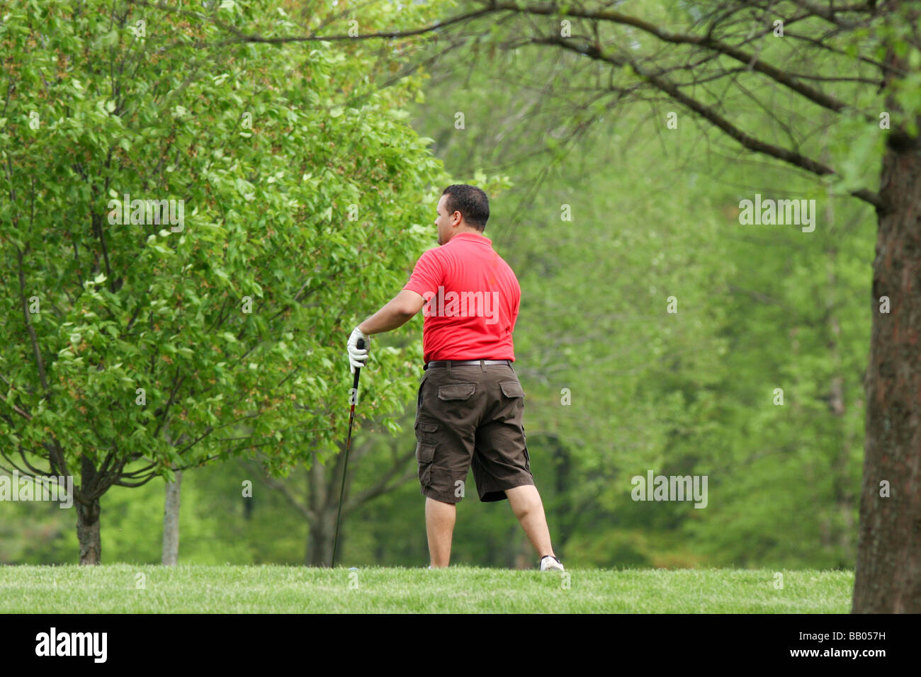 A male golfer on the driving tee at a public golf course in New Jersey