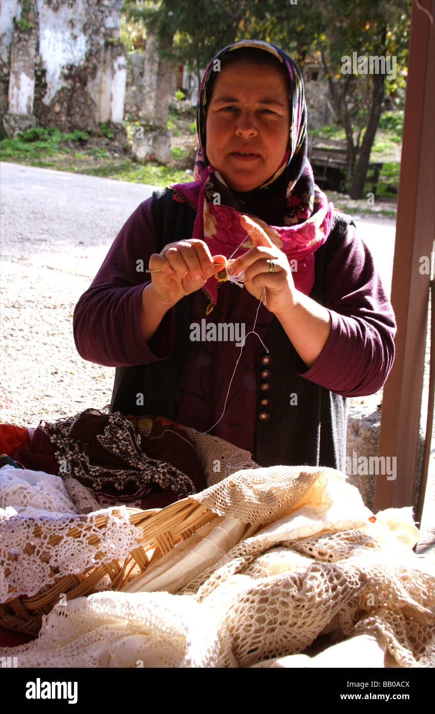 Village lady in Kaya Koy, Turkey - crocheting and selling her goods Stock Photo