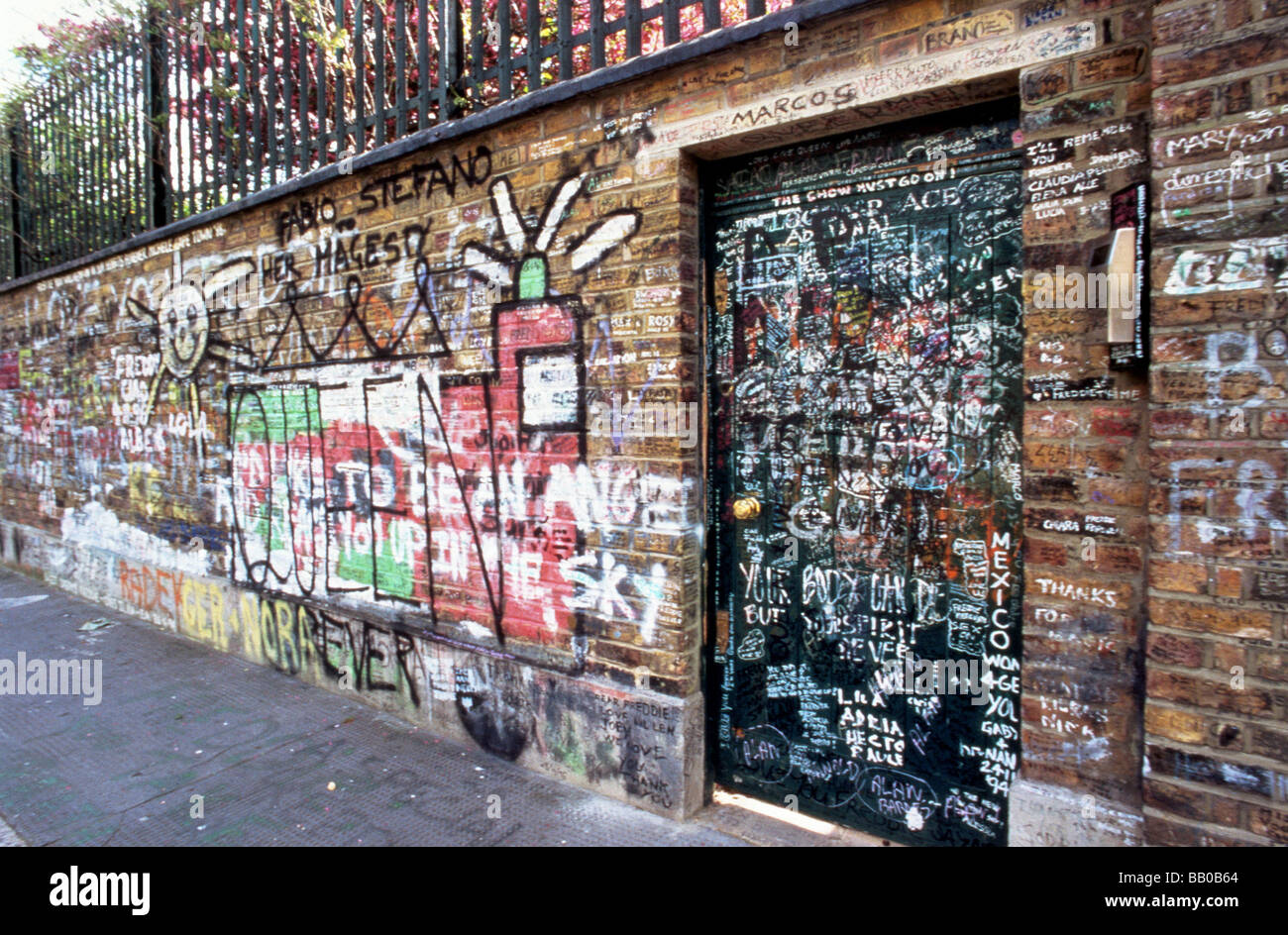 QUEEN Graffiti covering the wall of house at 1 Logan Place London where Freddie Mercury died Stock Photo