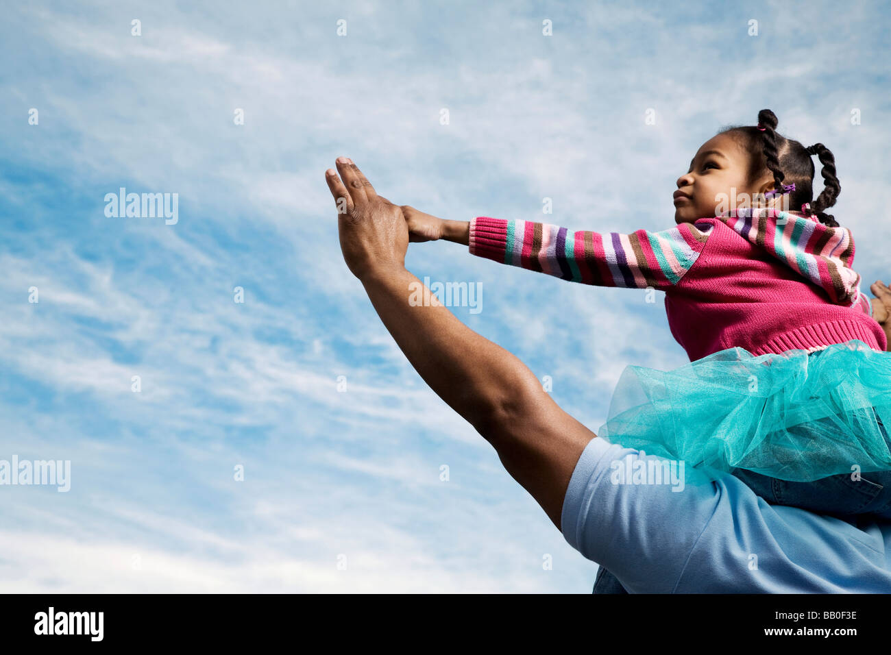 African father carrying daughter on shoulders Stock Photo - Alamy