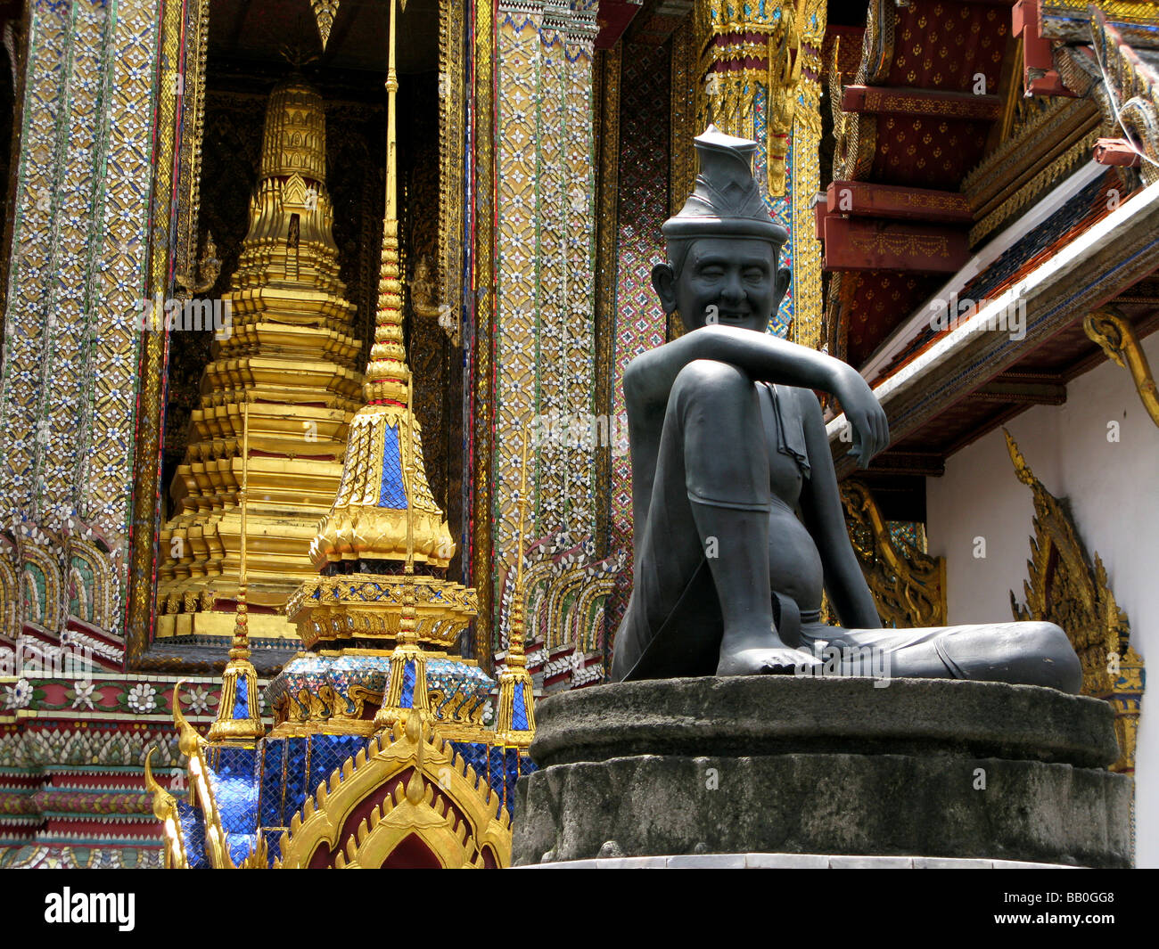 Statue and gilded decorations at Wat Phra Kaeo temple Bangkok Thailand Stock Photo