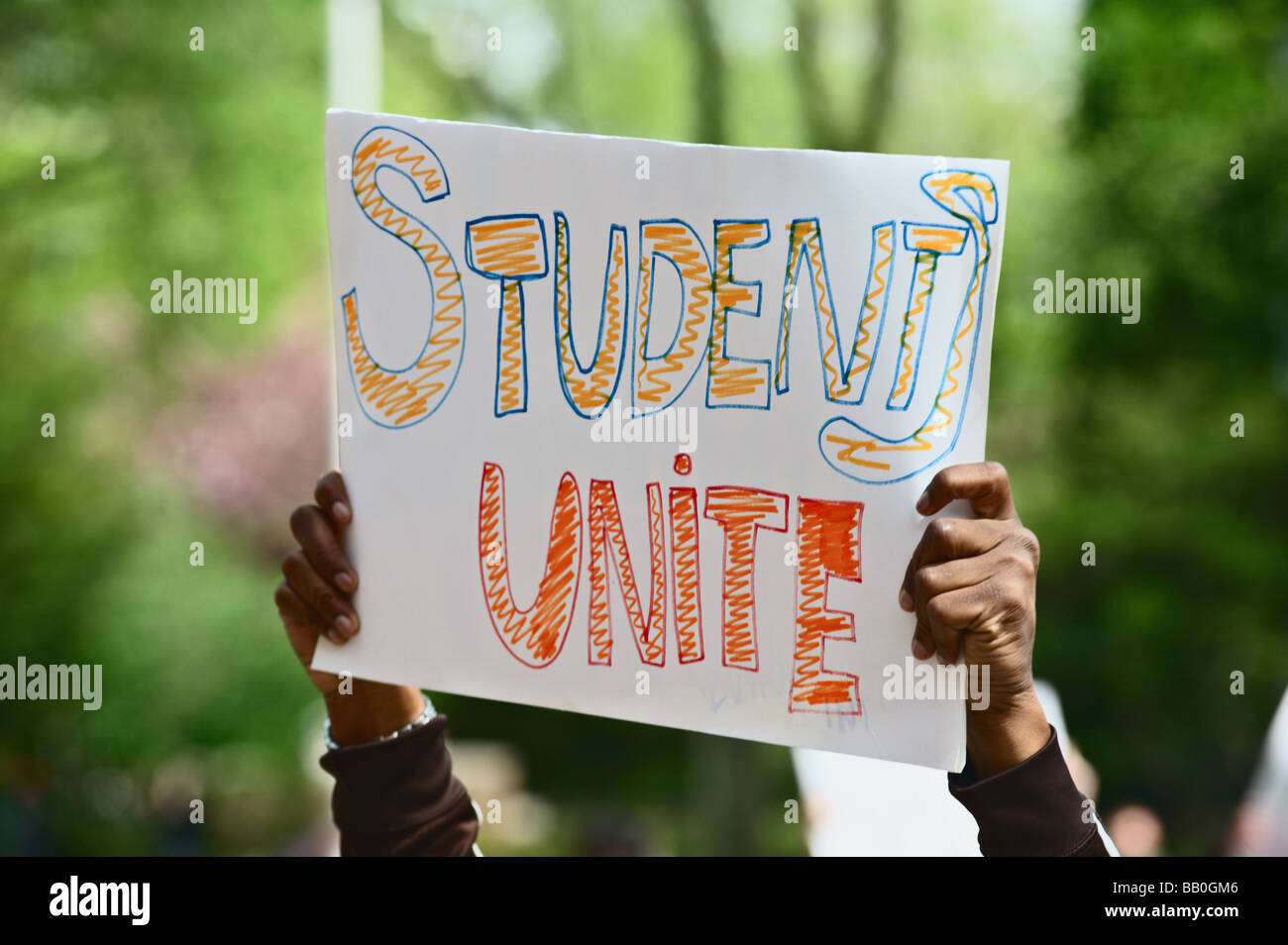 Hand made sign reading Students Unite at rally against tuition increase at Brooklyn College Brooklyn New York Stock Photo