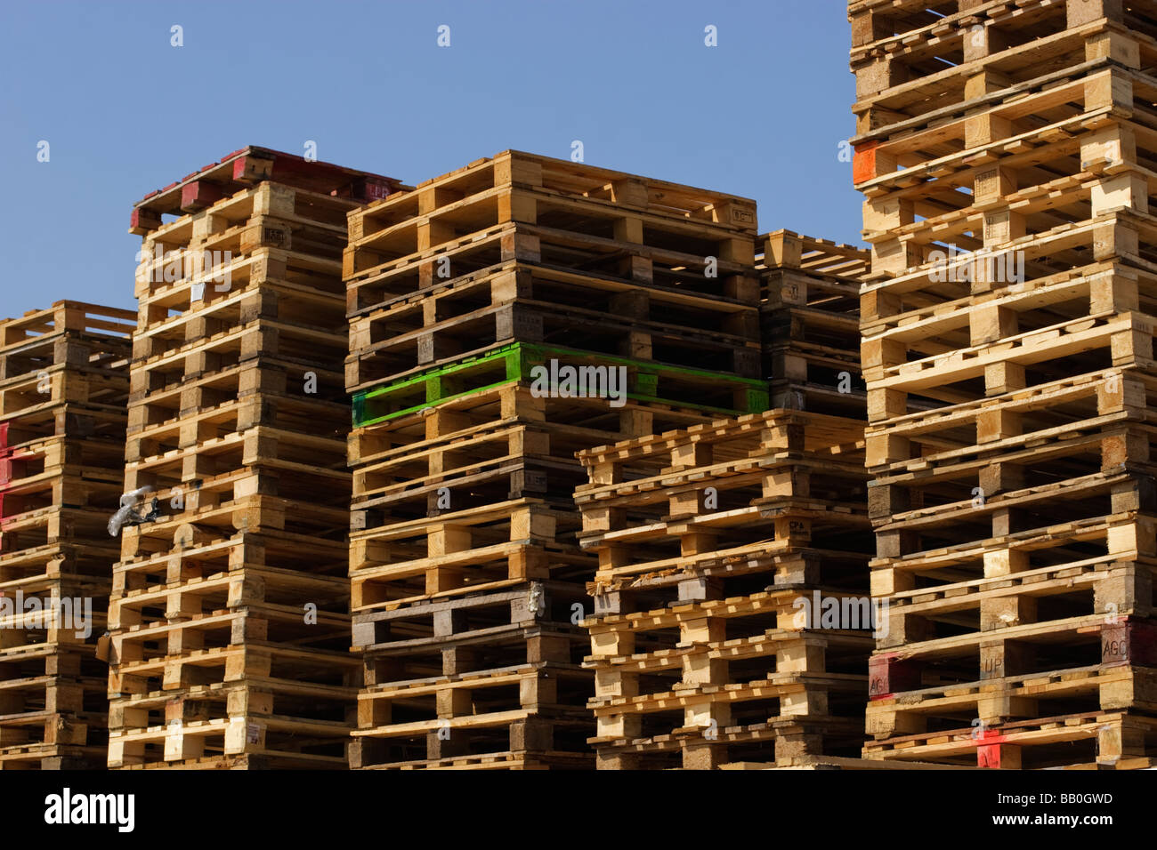 stacks of wooden pallets used for wholesale transportation of goods Stock Photo