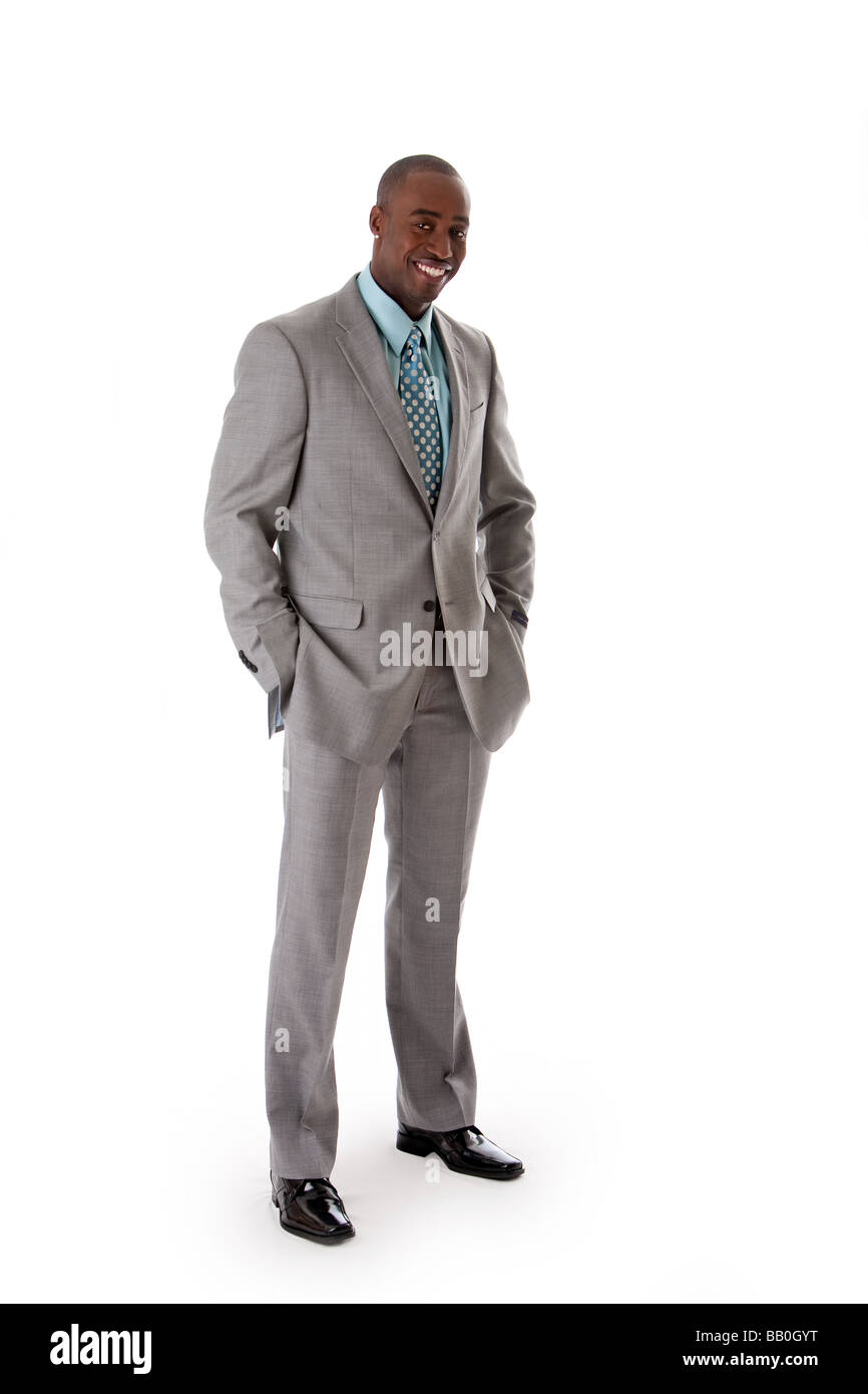Handsome African American man in gray suit with smile standing with ...