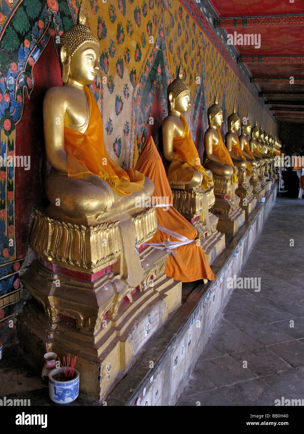 Row of golden buddhas Wat Arun Bangkok Thailand Stock Photo