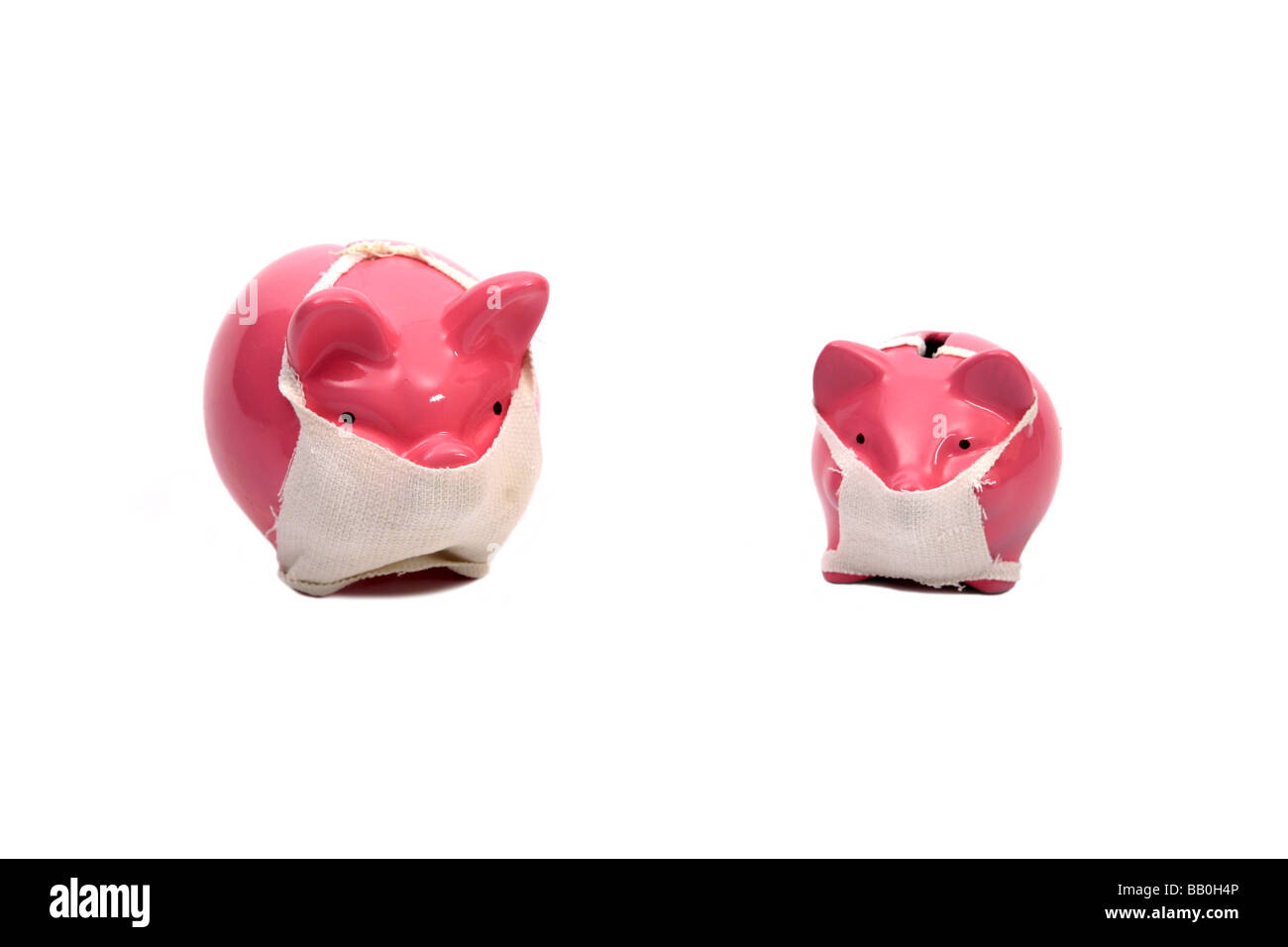 Pink Piggy bank pigs wearing face masks Relative to the Swine flu outbreak Stock Photo