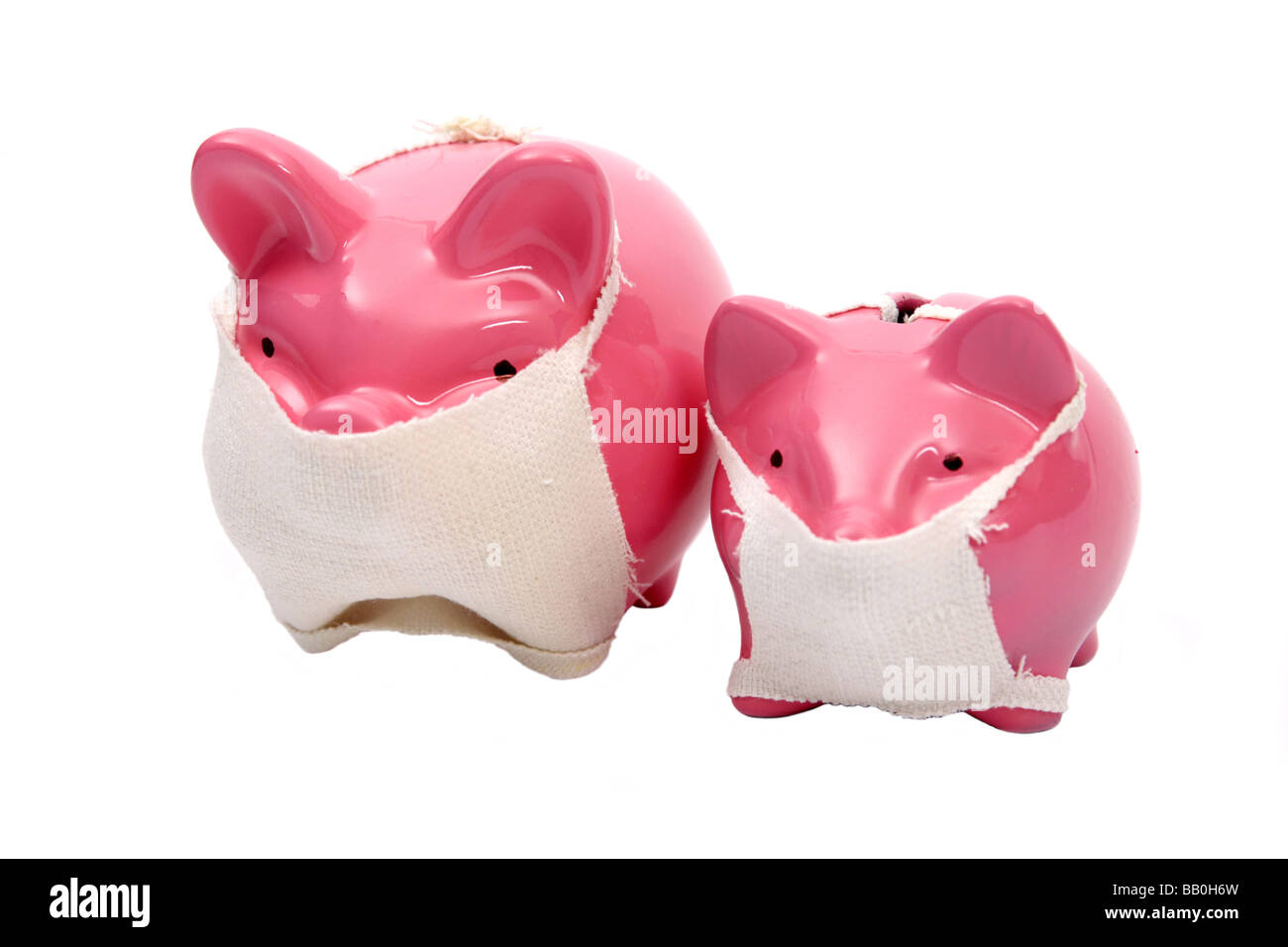 Pink Piggy bank pigs wearing face masks Relative to the Swine flu outbreak Stock Photo