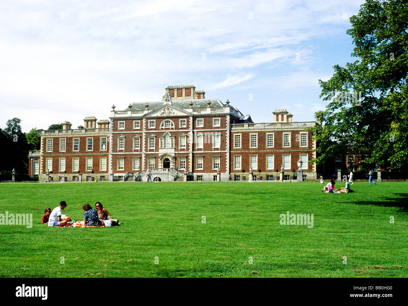 Wimpole Hall Cambridgeshire 17th century English stately home people picknicking architecture East Anglia England UK Stock Photo