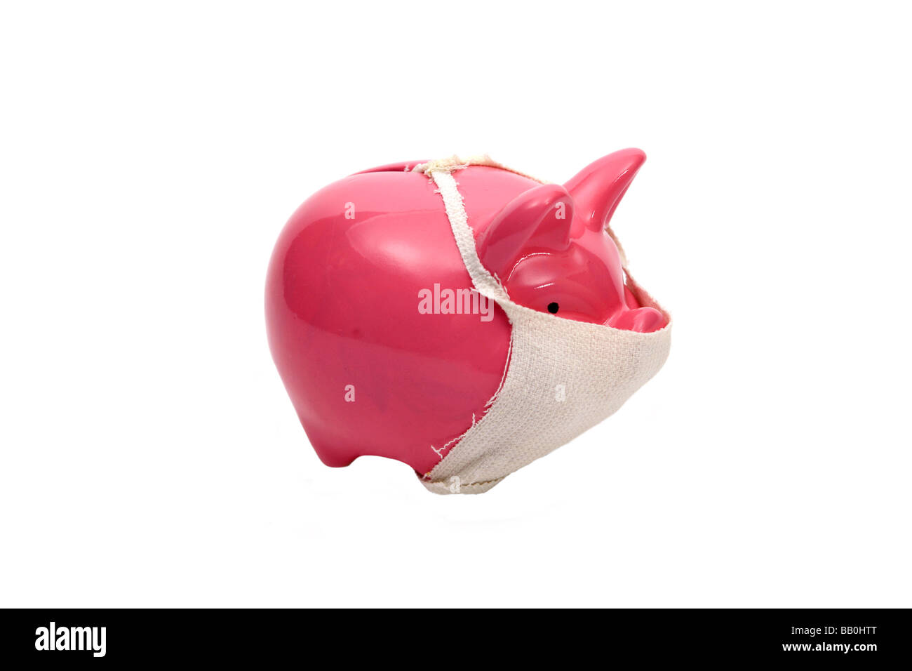 Pink Piggy bank pig wearing face mask Relative to the Swine flu outbreak Stock Photo