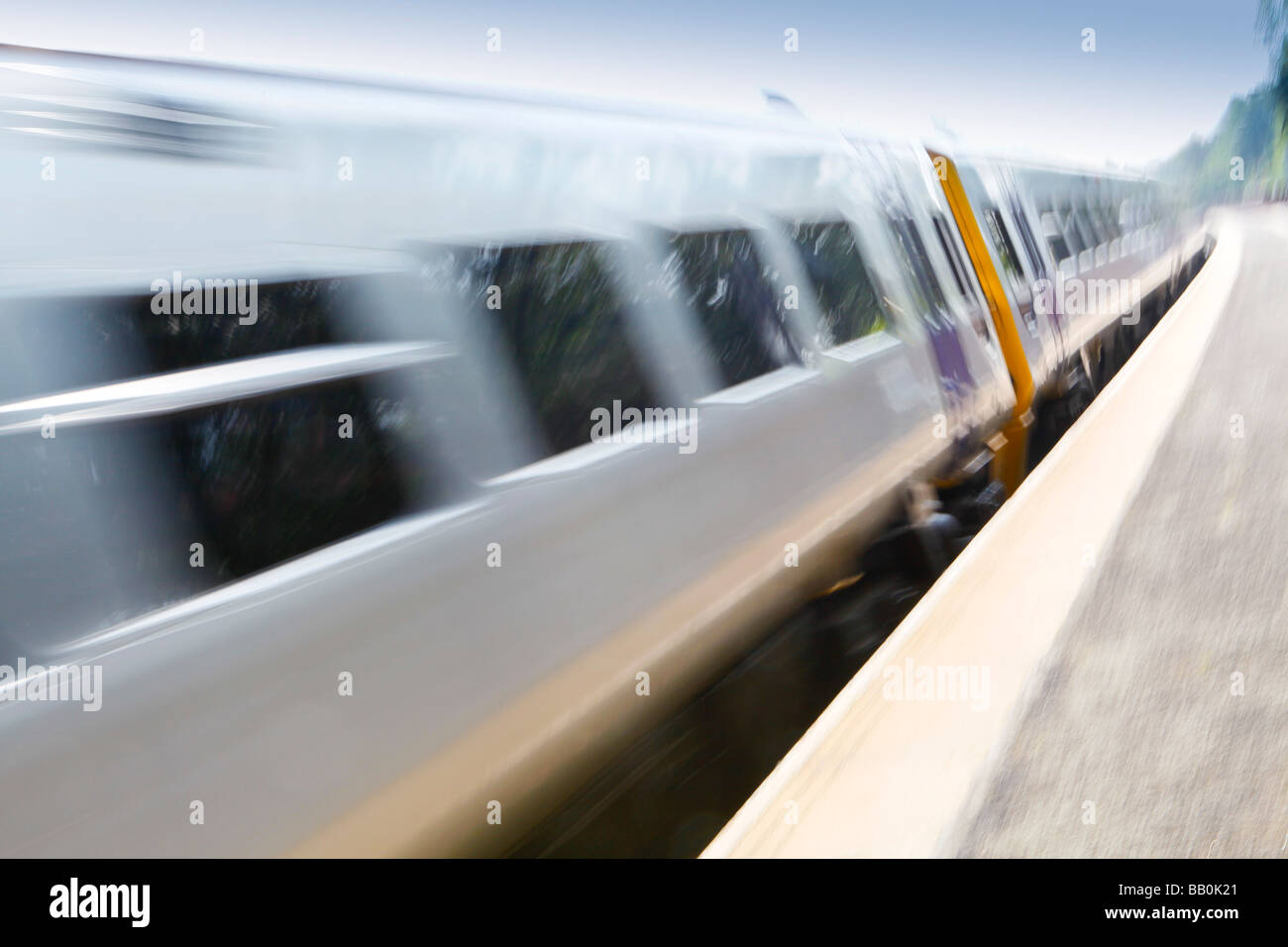 Train moving fast through the station. Stock Photo