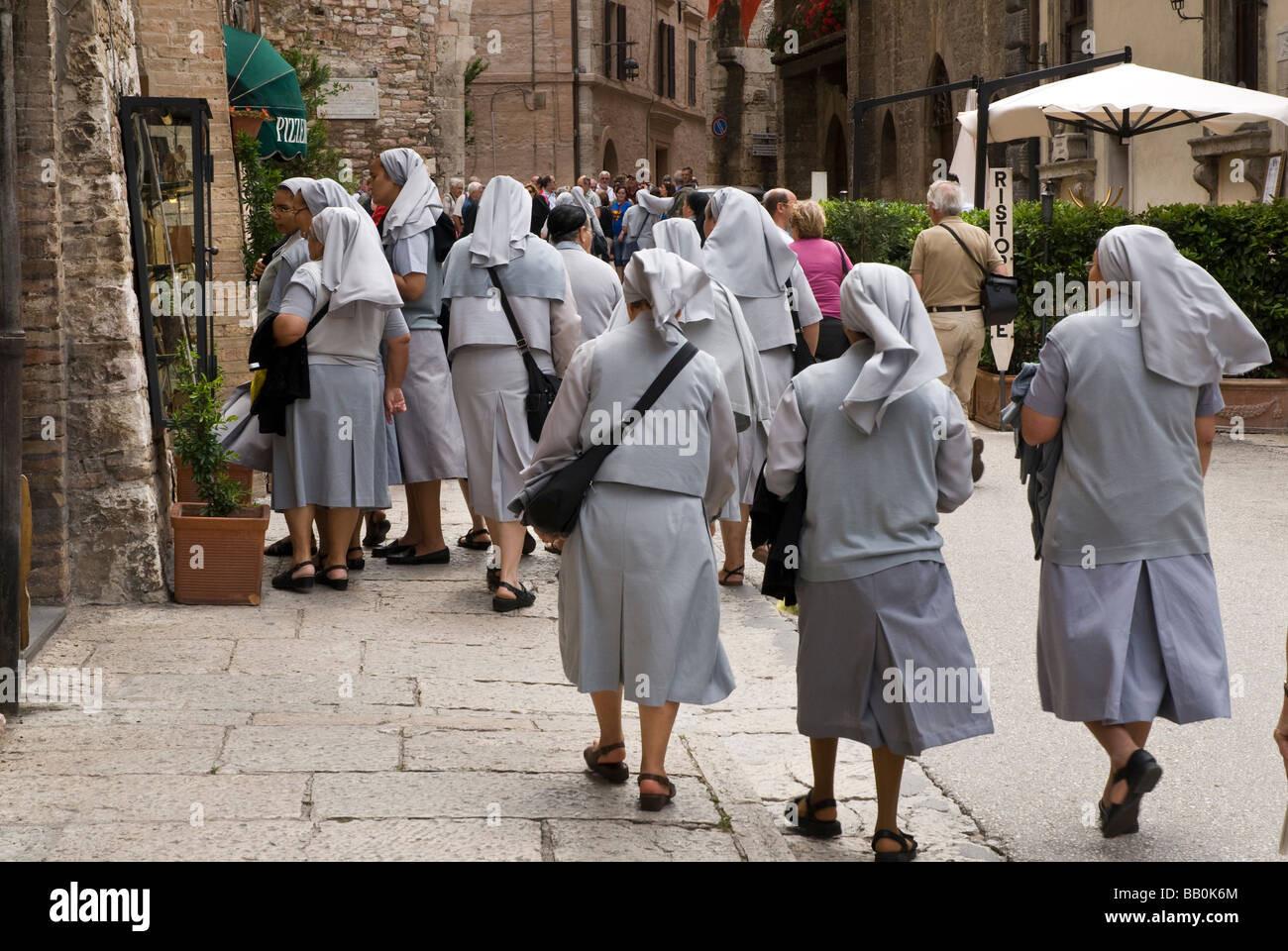 Nuns viewing menu for lunch in Assisi Stock Photo