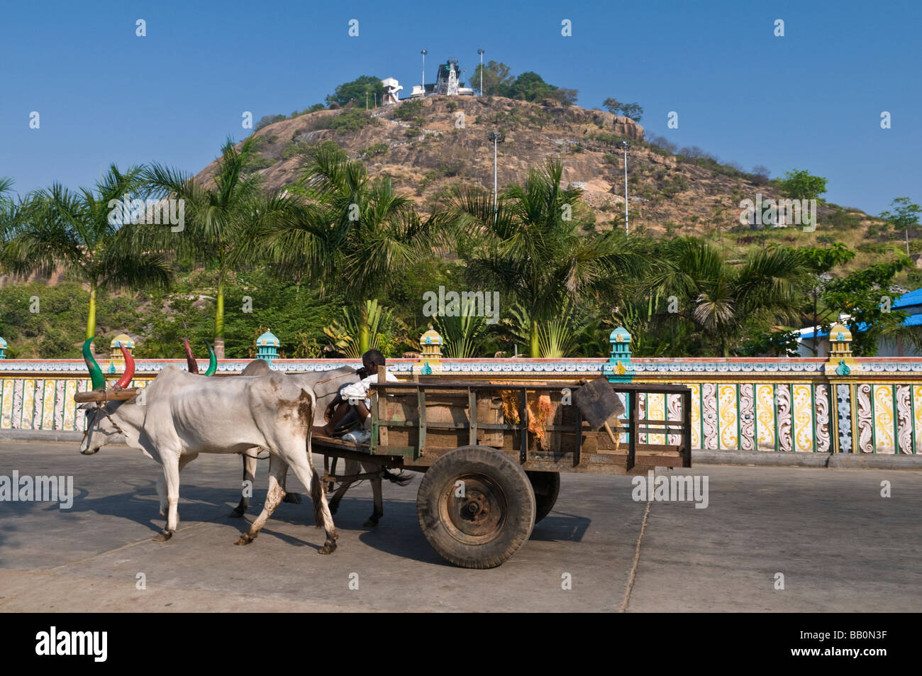Bullock cart and hill top shrine Palani Tamil Nadu India Stock Photo