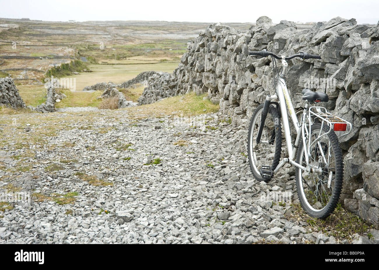 Hiring a bike is so it seems the only means of travel on Inish Mor Ireland Stock Photo