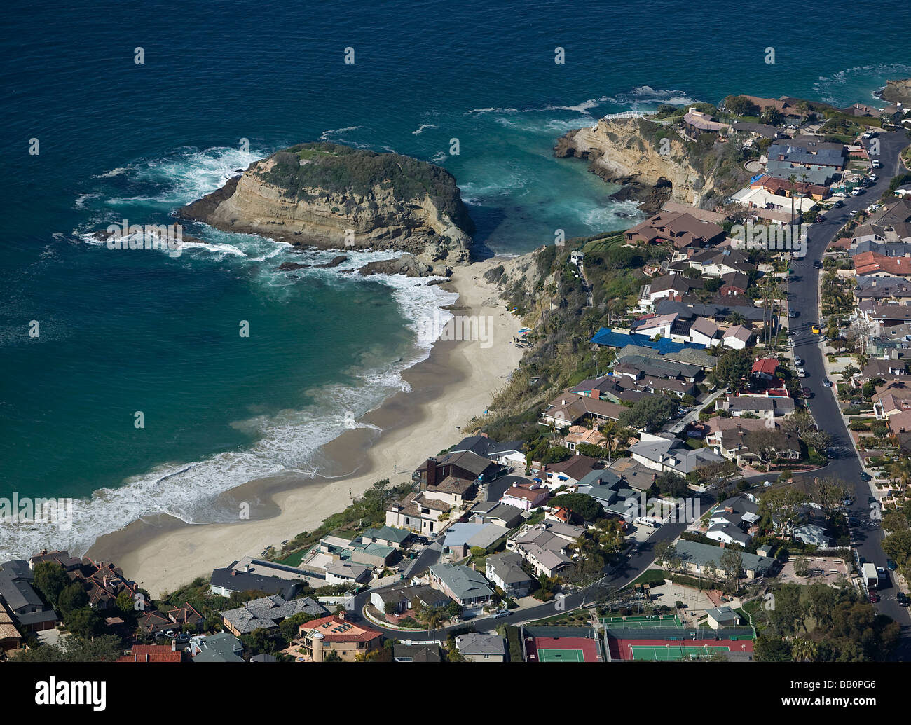 aerial view above Pacific ocean side residential properties Mussel Cove southern California Stock Photo