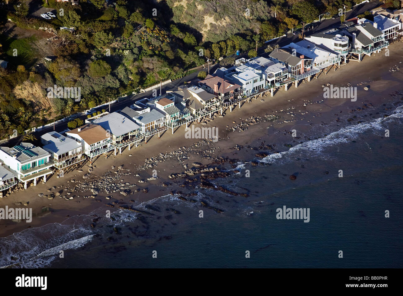 aerial view above Pacific ocean waterfront beach houses on stilts near Malibu Beach California Stock Photo