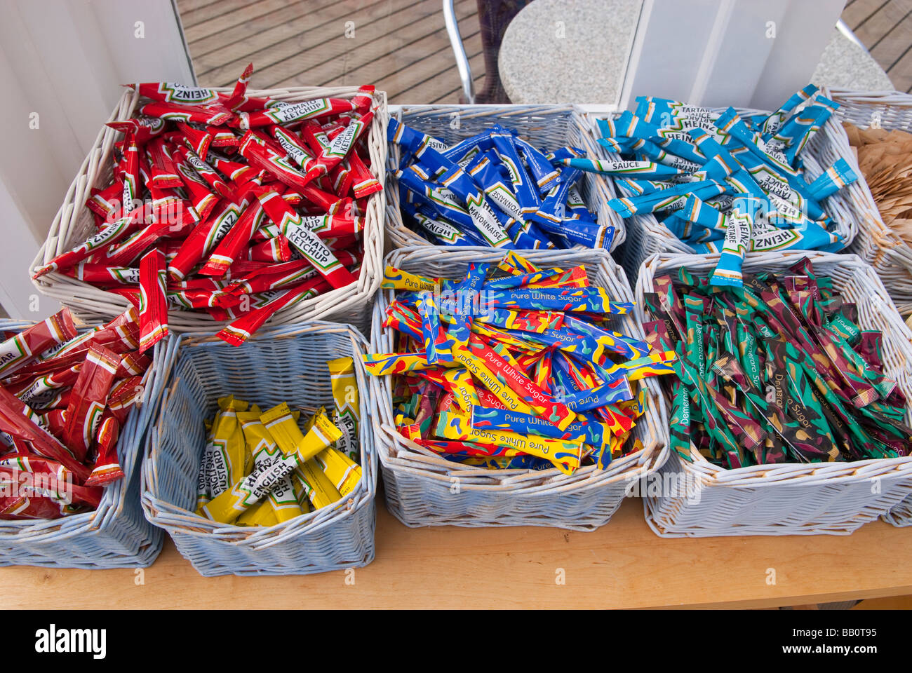 Sachets full of sugar,tomato ketchup,vinegar,english mustard,mayonaise