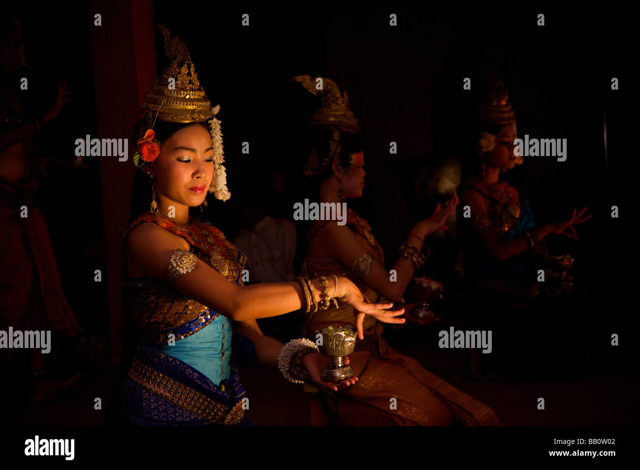 Girl performing traditional dance with cup in Siem Reap, Cambodia near Angkor Wat Stock Photo