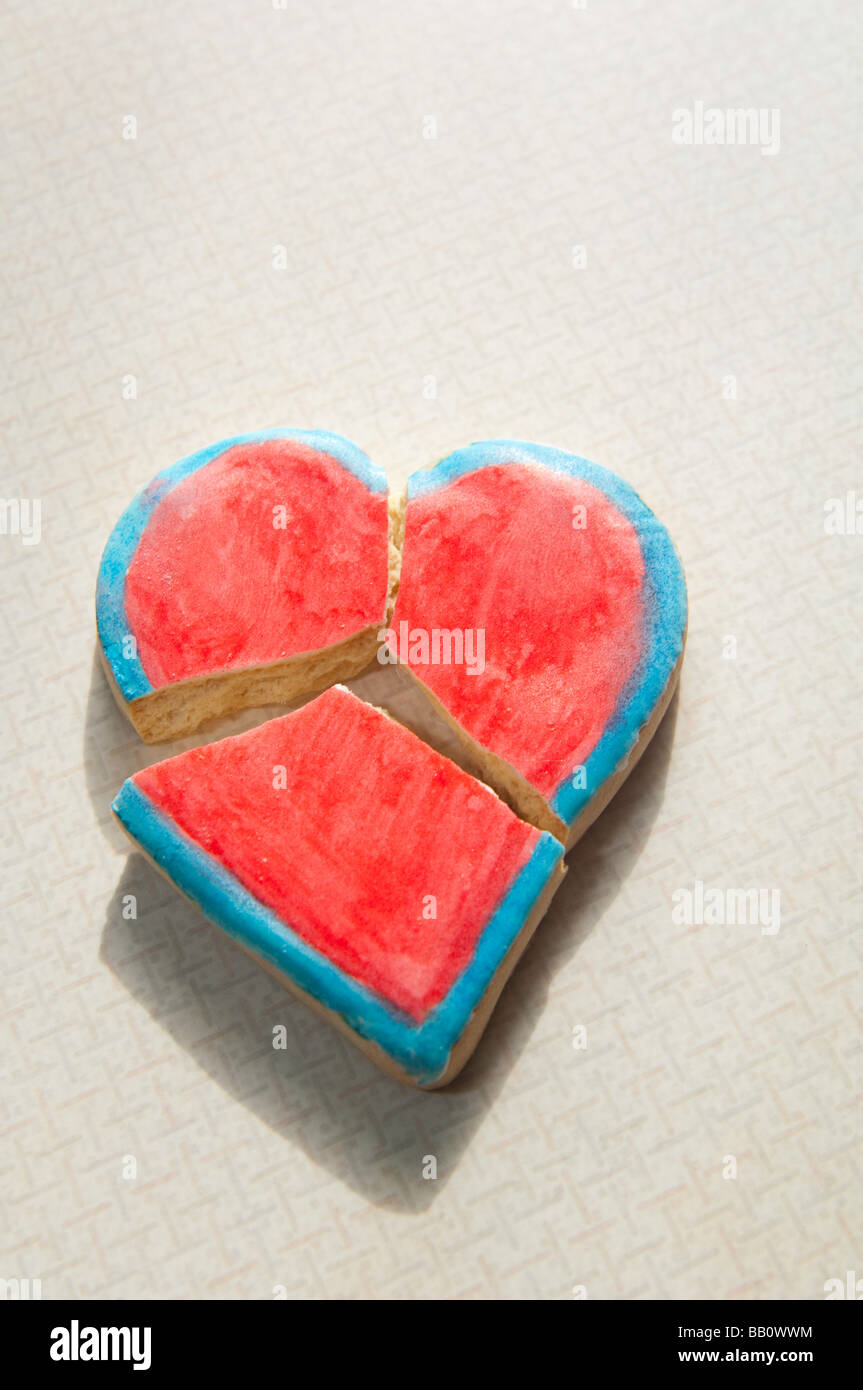 Broken heart-shaped Valentine cookie, no crumbs. Stock Photo