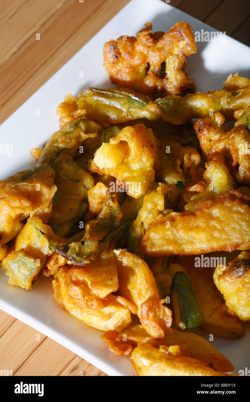 Vegetable Fritters is a snack which is made from vegetables dipped in a