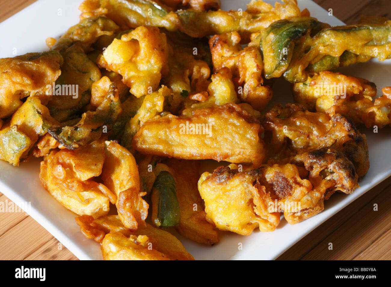 Vegetable Fritters is a snack which is made from vegetables dipped in a