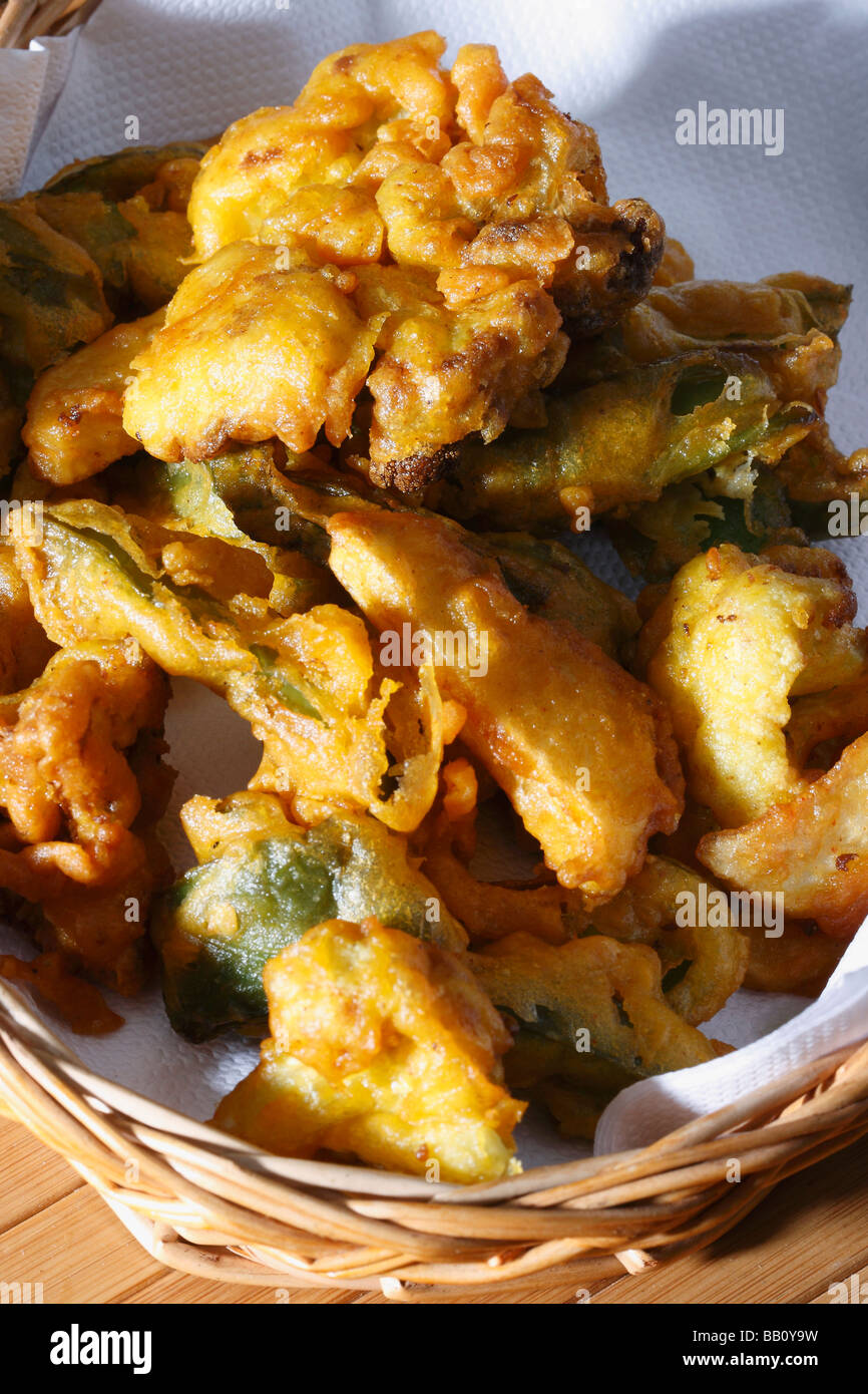 Vegetable Fritters is a snack which is made from vegetables dipped in a gram flour batter and