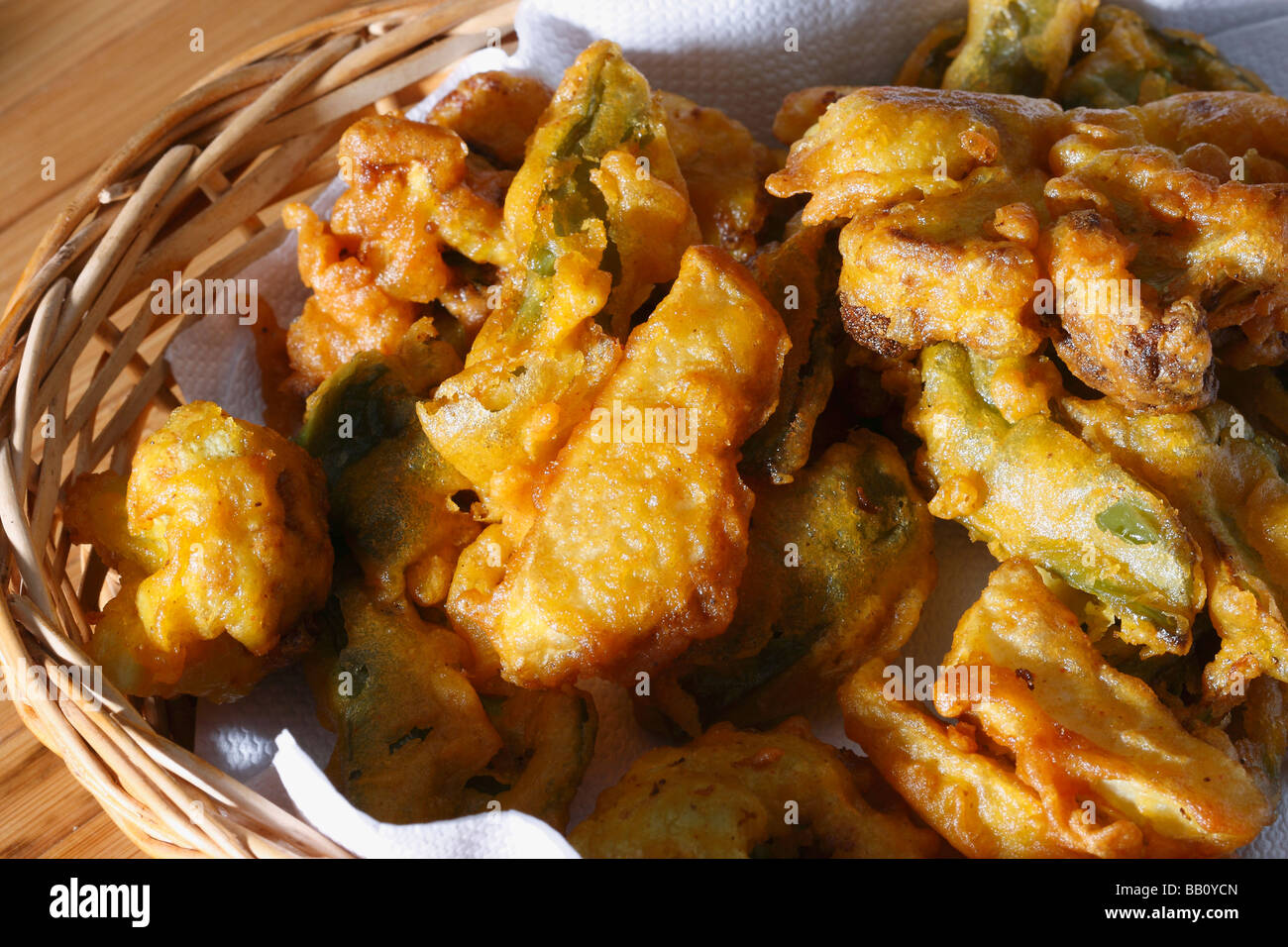 Vegetable Fritters is a snack which is made from vegetables dipped in a gram flour batter and