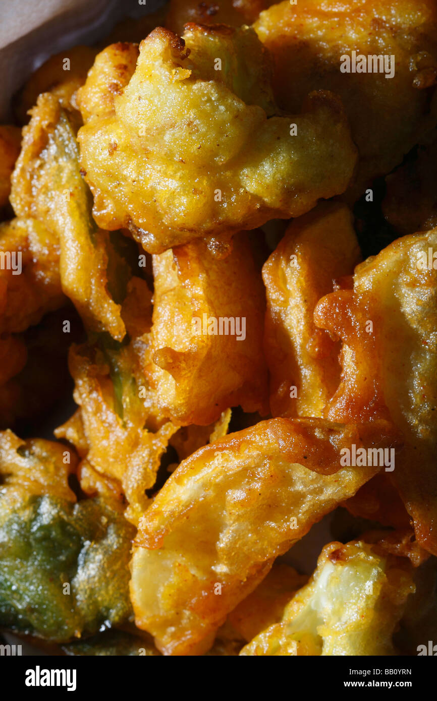 Vegetable Fritters is a snack which is made from vegetables dipped in a gram flour batter and