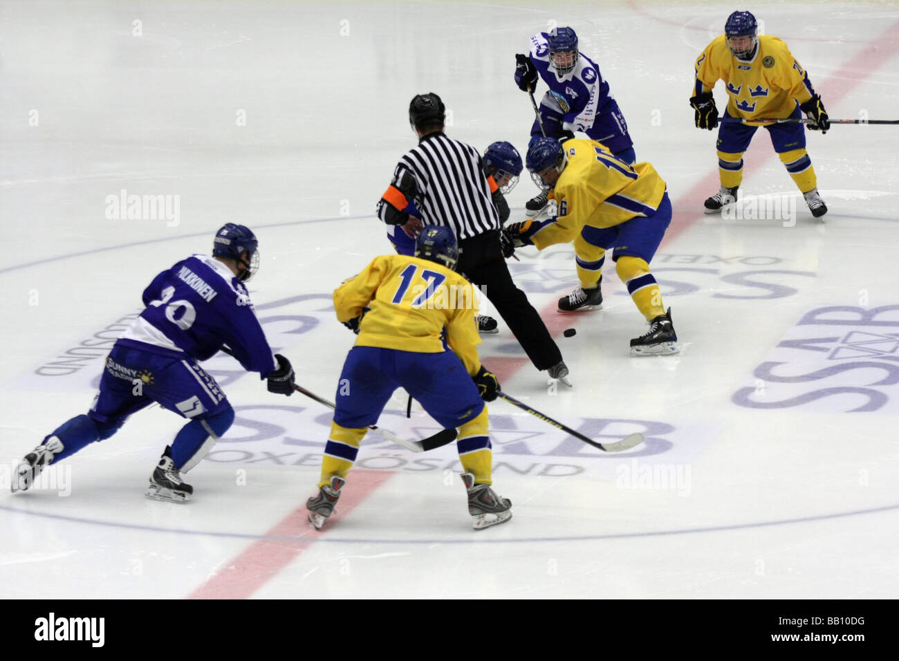 Face-off in a U18 ice-hockey tournament between Sweden and Finland. Stock Photo