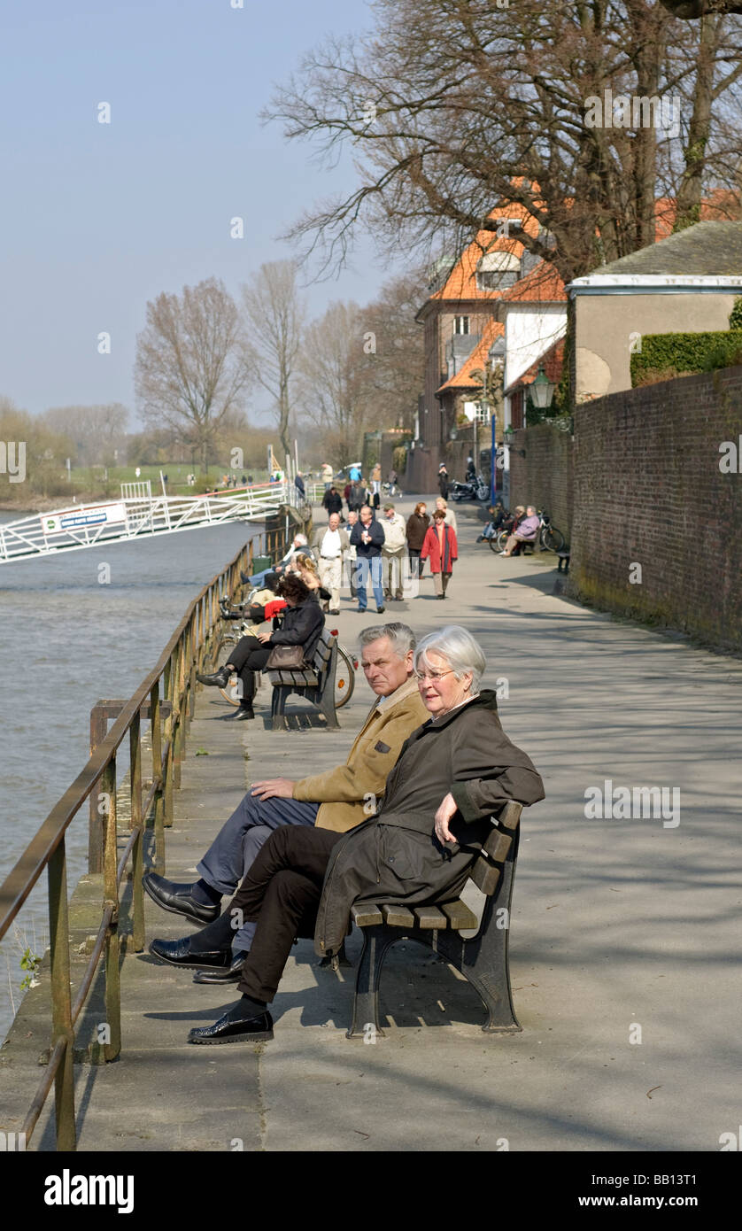People relaxing in sunshine next to the Rhine, Düsseldorf-Kaiserswerth, NRW, Germany. Stock Photo