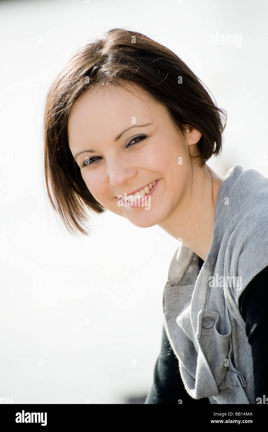 Outdoor portrait of a pretty young teenage girl smiling Stock Photo - Alamy