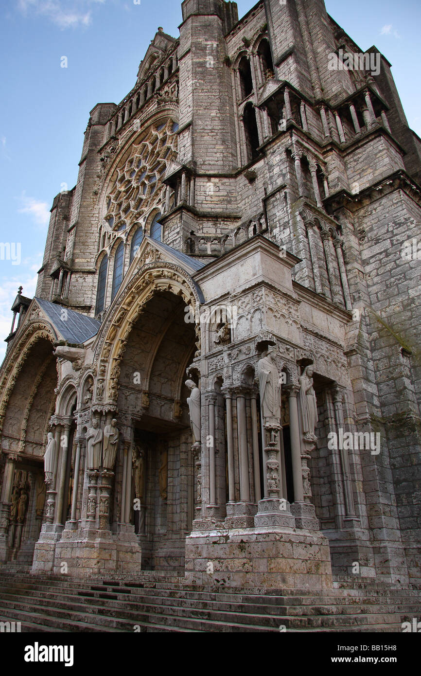 The front facade of Chartres cathedral with an almost clear blue sky beyond. France. Stock Photo