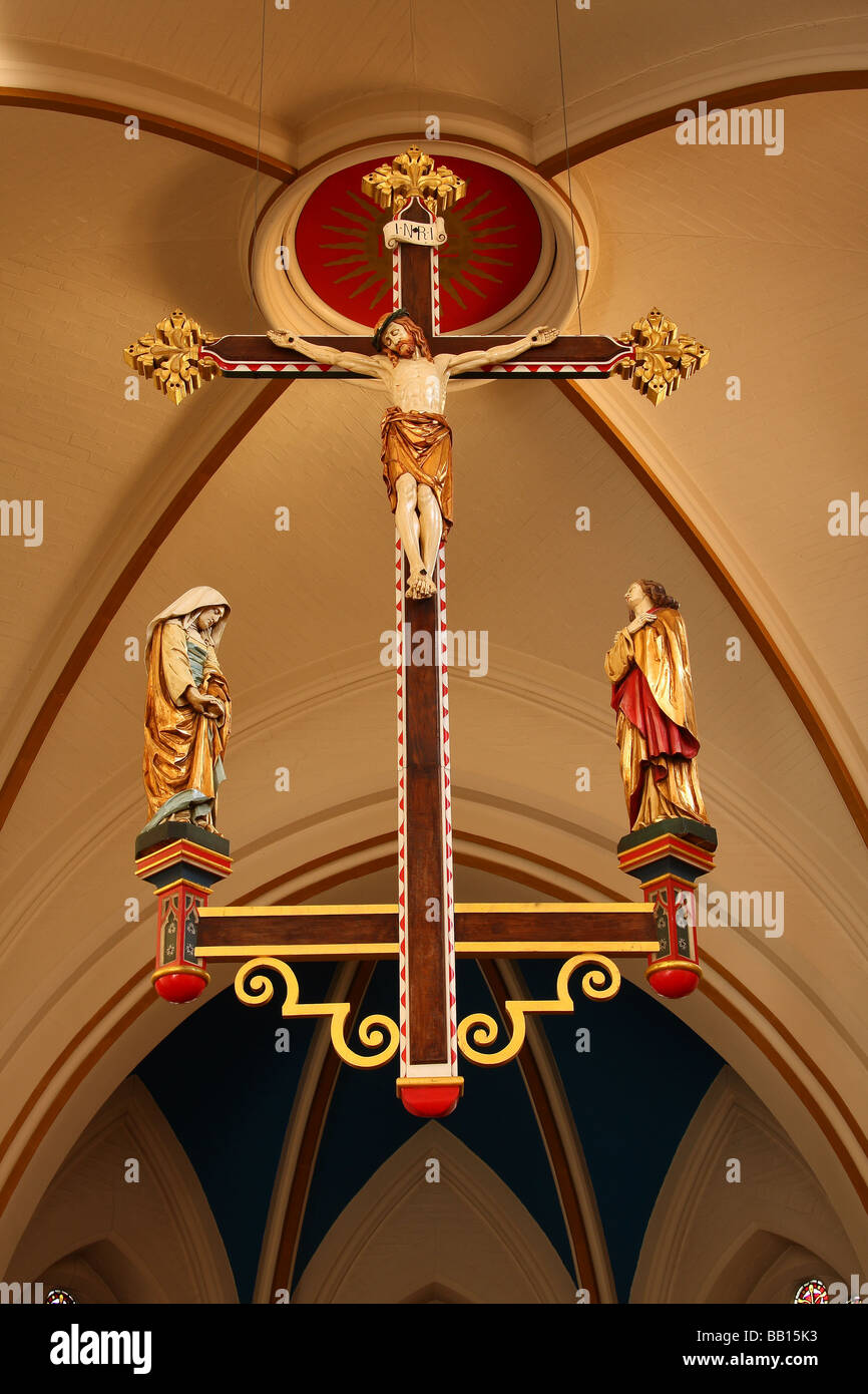 a view of the cross above the alter at St Nicolas church in Guildford Surrey Stock Photo