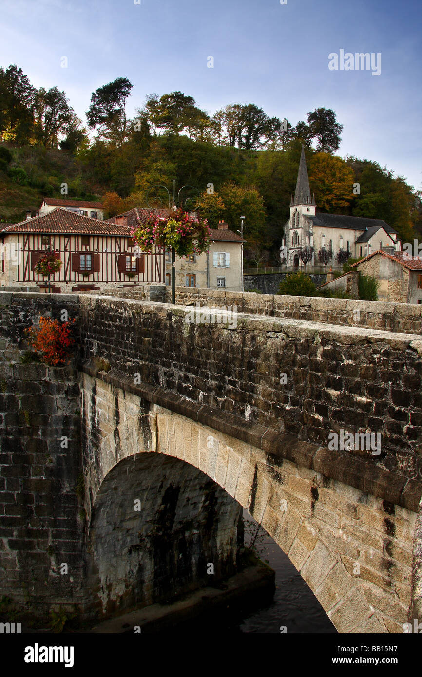 A view of the old town bridge at St Leonard de Noblat. Limousin France. Stock Photo