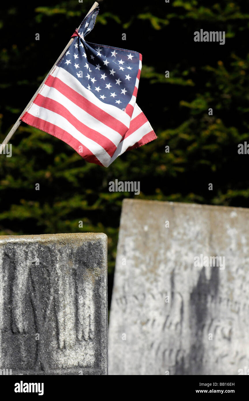 Historical cementary with american flag and revolutionary soldiers Stock Photo