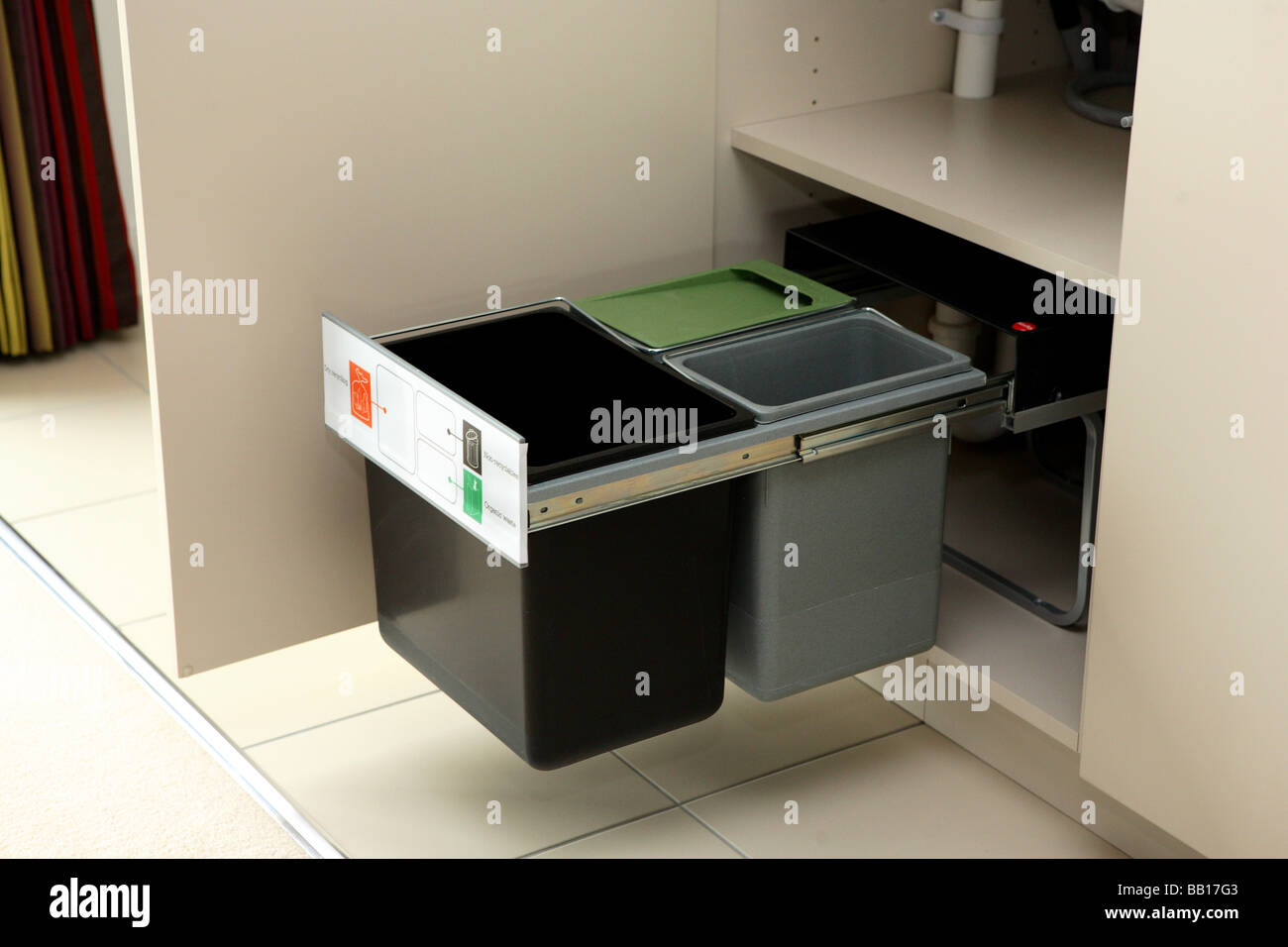 recycling bins in kitchen unit Stock Photo Alamy