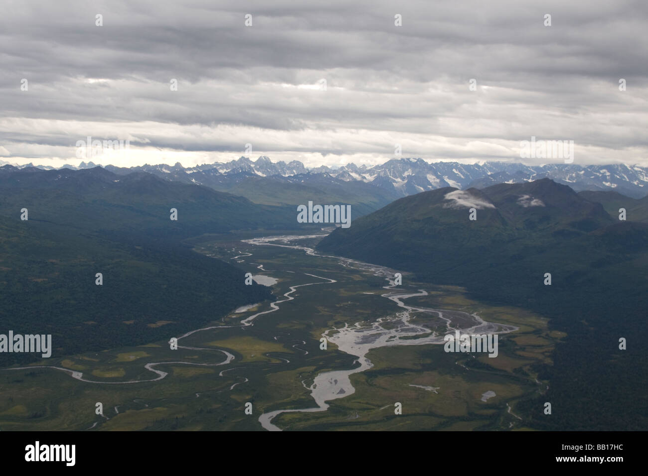 Aerial alaska mountain range picture including a curving river Stock