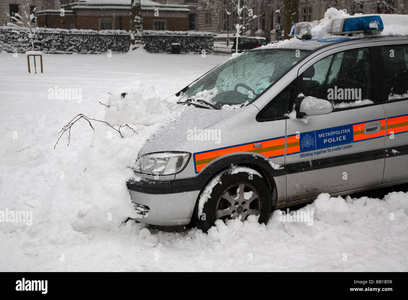 Police car and snowman Stock Photo Alamy