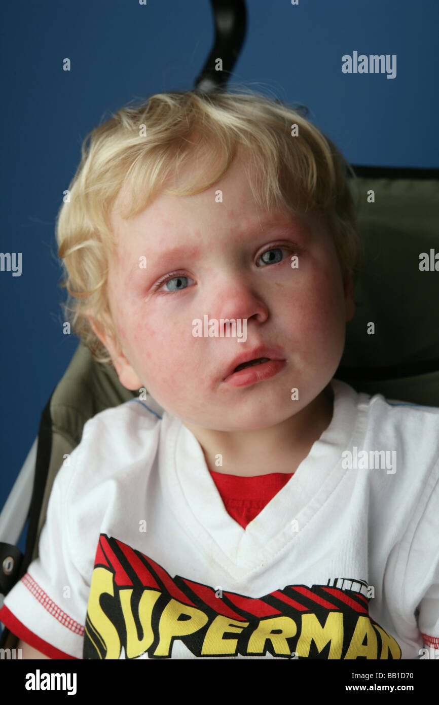 Close up of a child who has just finished crying and still has tears in