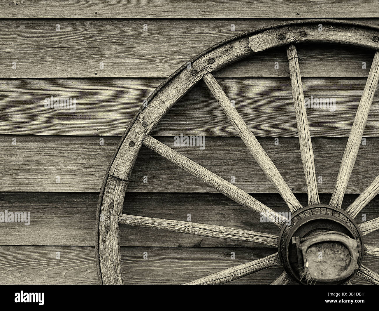 Old wooden cart wheel Stock Photo