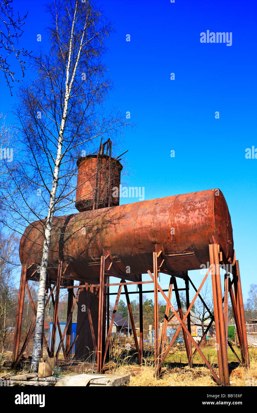 Old rusty elevated water tank Stock Photo