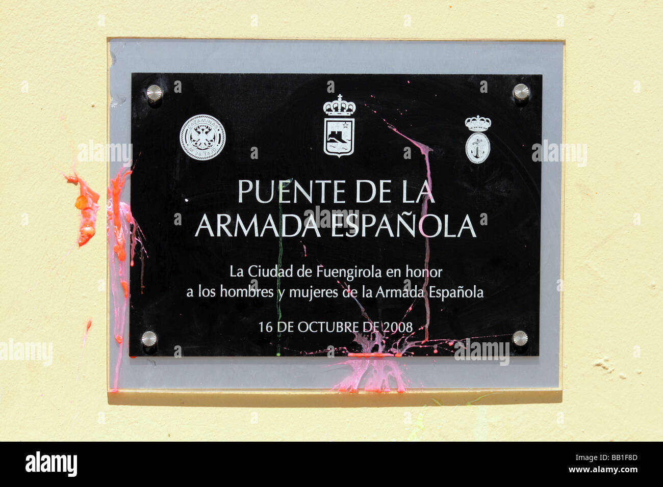 a commemorating plaque for the spanish navy shot with paintballs during