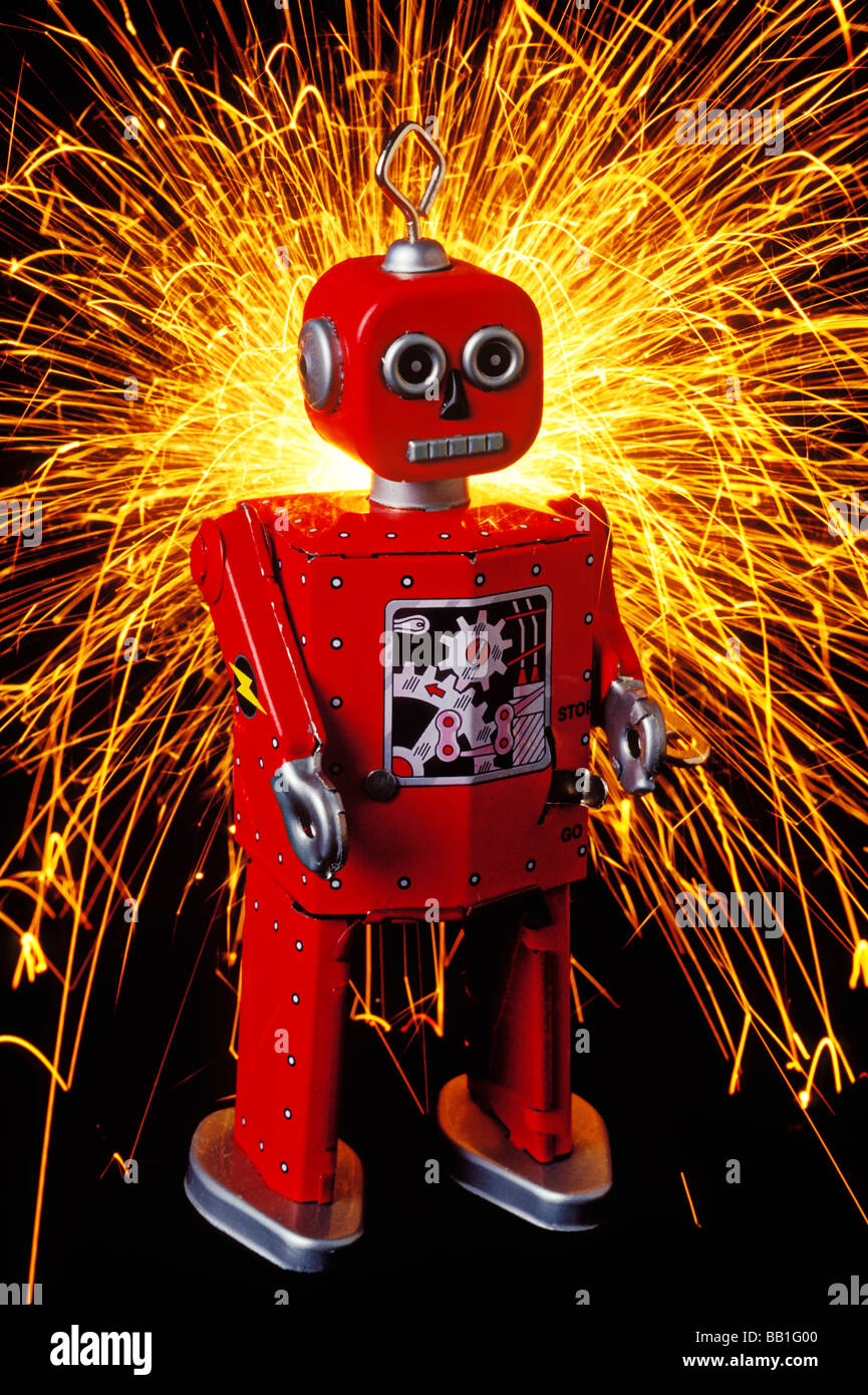 Red toy robot with sparks Stock Photo