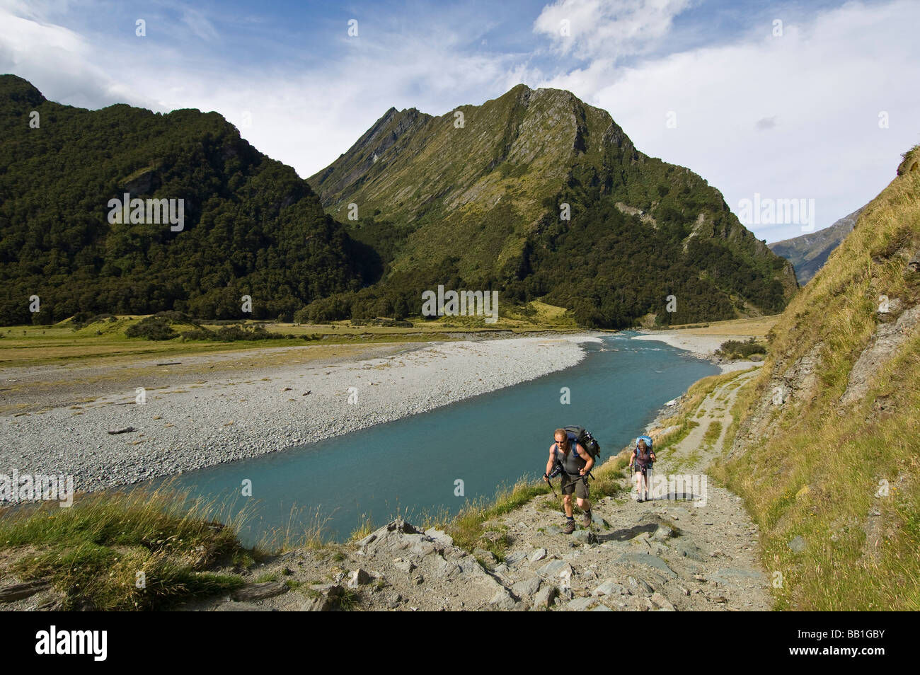 Hikers in West Matukituki River valley Mt Aspiring National Park South Island New Zealand Stock Photo