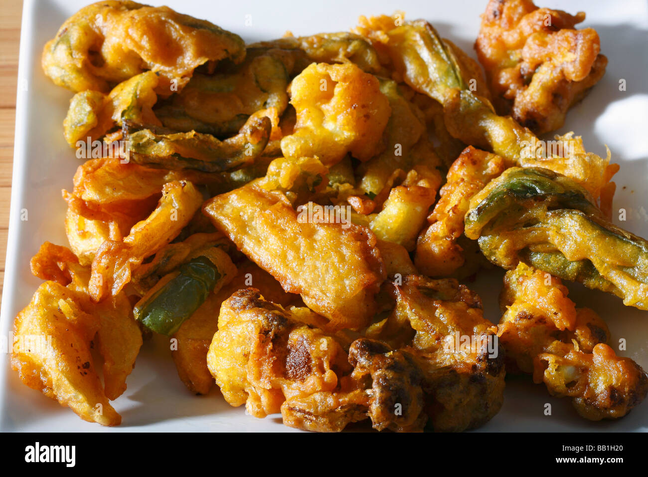 Vegetable Fritters is a snack which is made from vegetables dipped in a