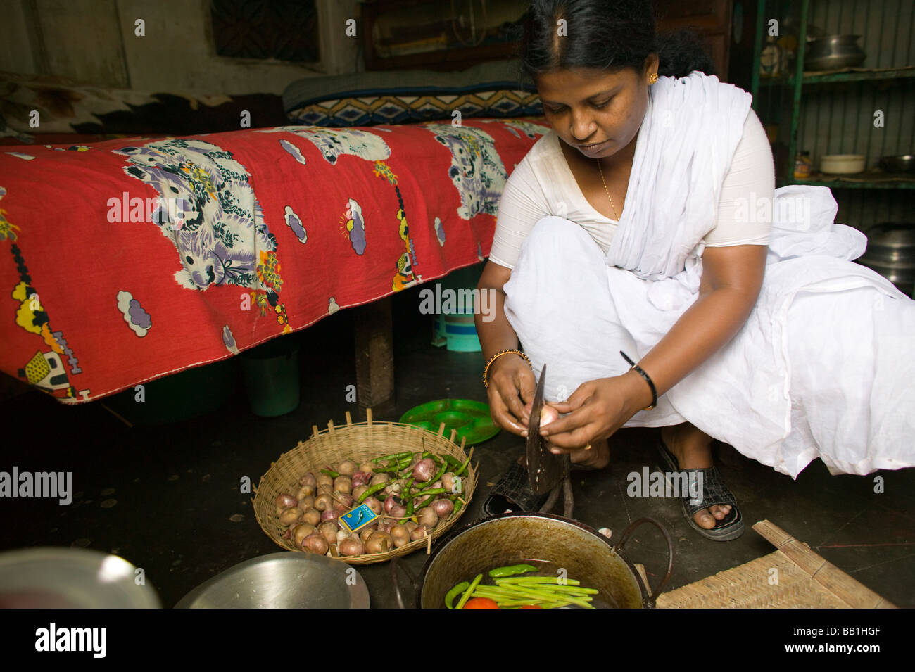 Leader for women's rights making food in brothel, Tangail, Bangladesh. Stock Photo