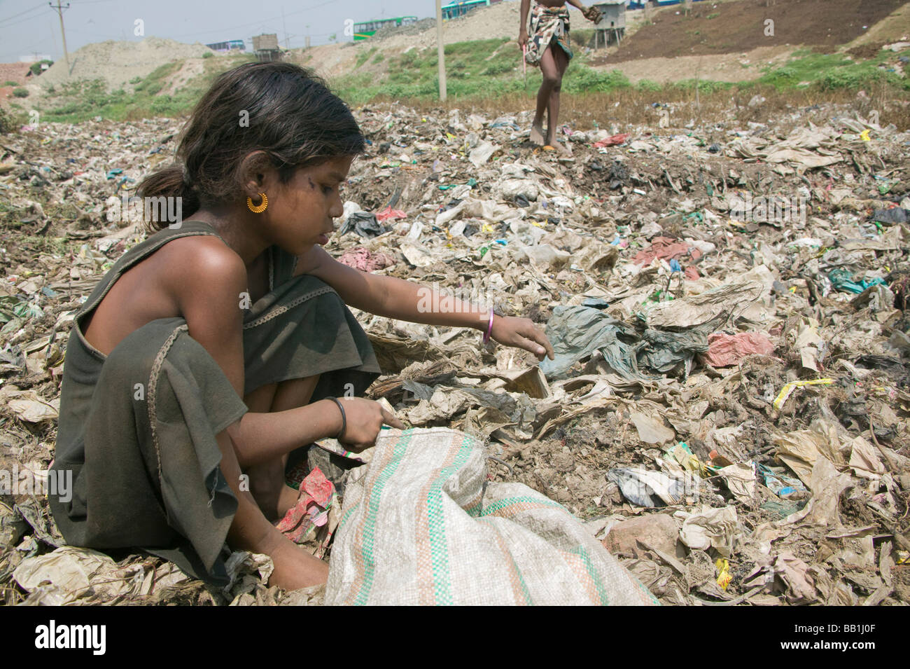 Children scavenging in garbage dump, Dhaka, Bangladesh Stock Photo
