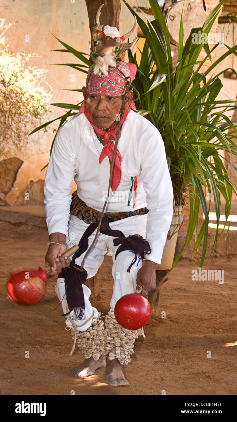 Native man dancing in ceremonial dance costume in Mayo village of Capomos outside El Fuerte in the state of Sinaloa Mexico. Stock Photo