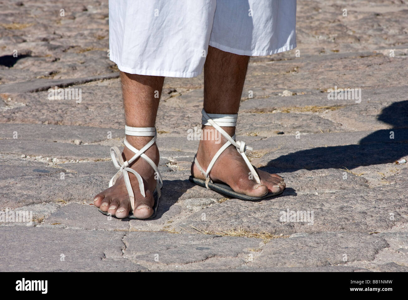 Native man wearing hurache sandal made of leather thongs with car tires ...