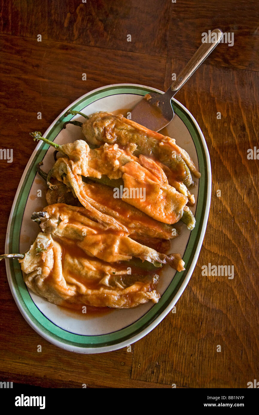 Chiles rellenos a dish made with large chiles that are stuffed with cheese coated with batter and fried Mexico Stock Photo