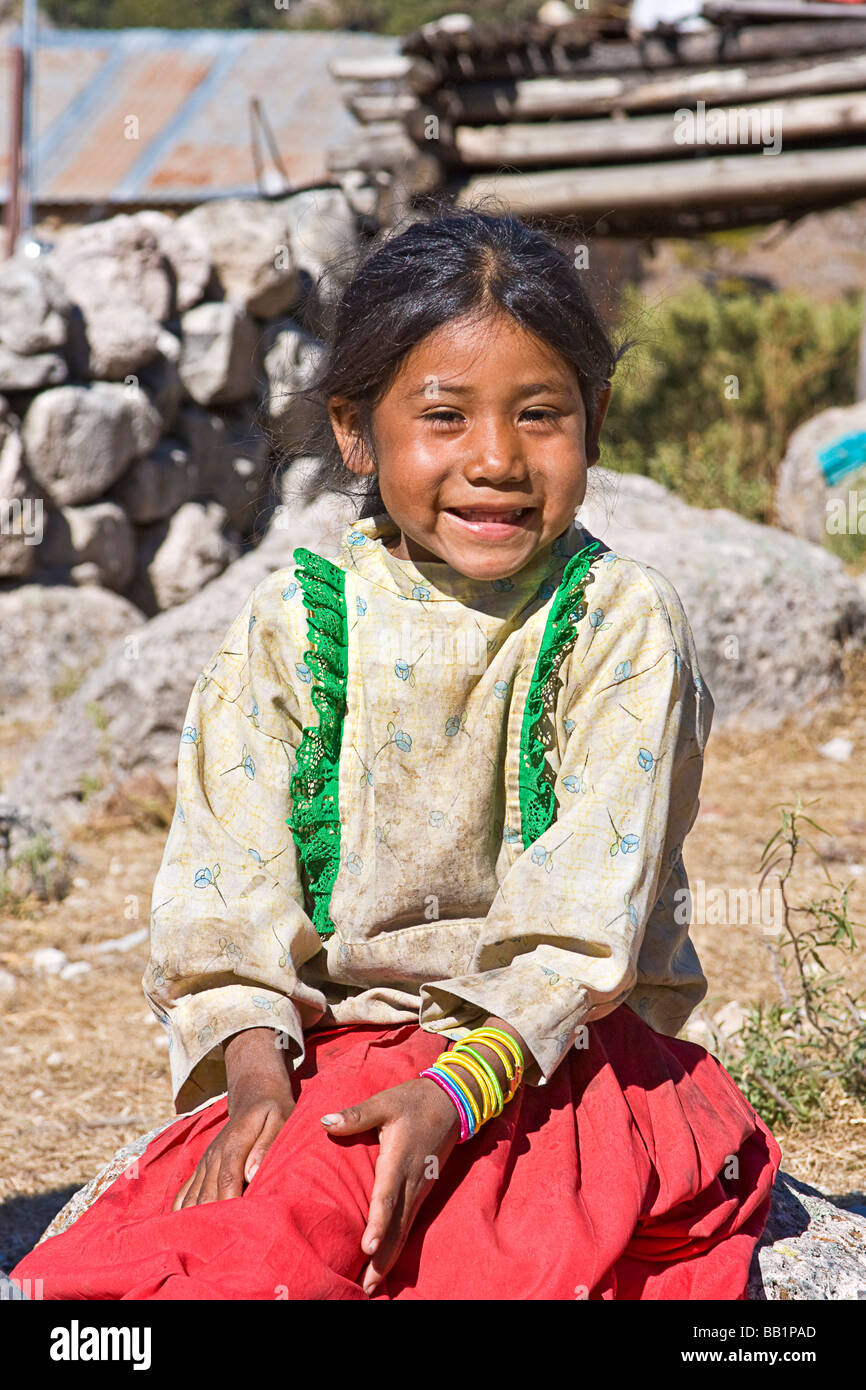 https://c8.alamy.com/comp/BB1PAD/young-girl-sits-by-her-simple-adobe-and-log-home-in-the-tarahumara-BB1PAD.jpg